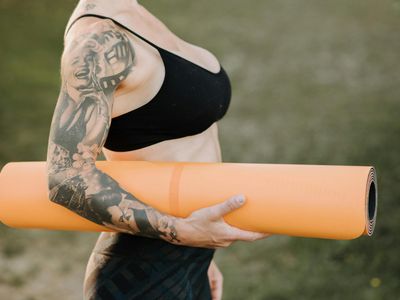 A single rolled-up yoga mat in a quiet corner.